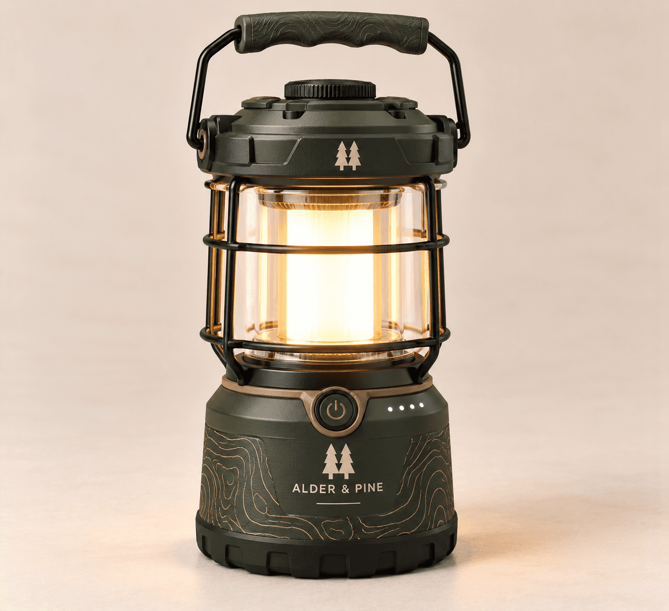 Ember Camp Lantern in forest green with a steel cage glowing warm white