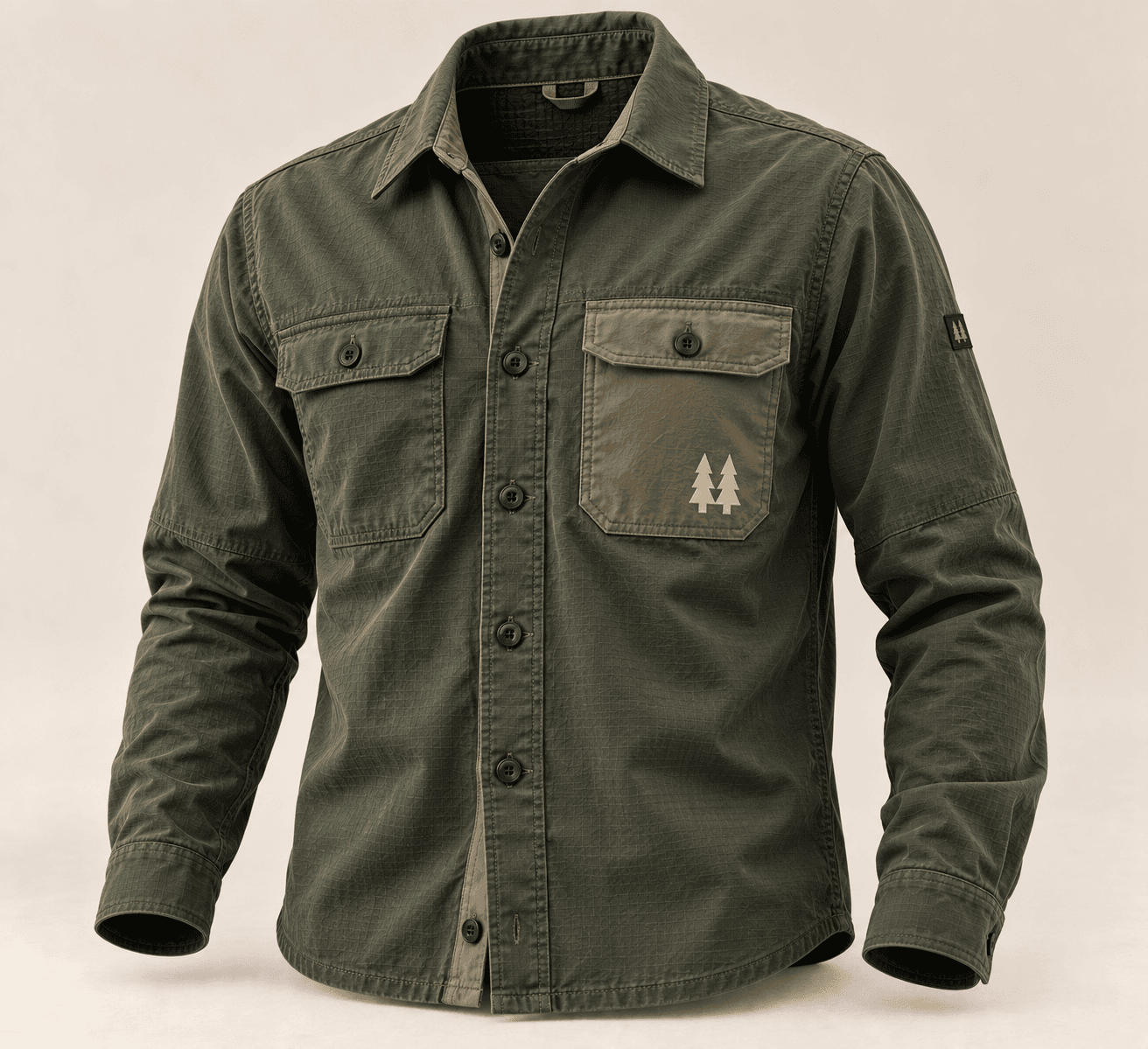 Mountain Overshirt in olive with dual chest pockets and a tan pine-tree patch