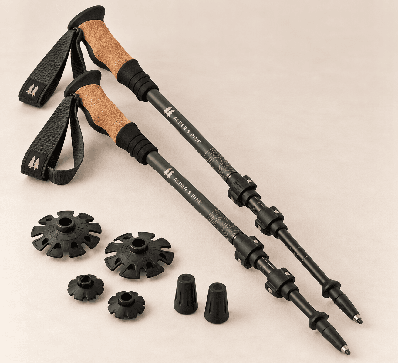 A pair of Ridgewalker Trekking Poles with cork grips, olive-accented shafts and interchangeable baskets