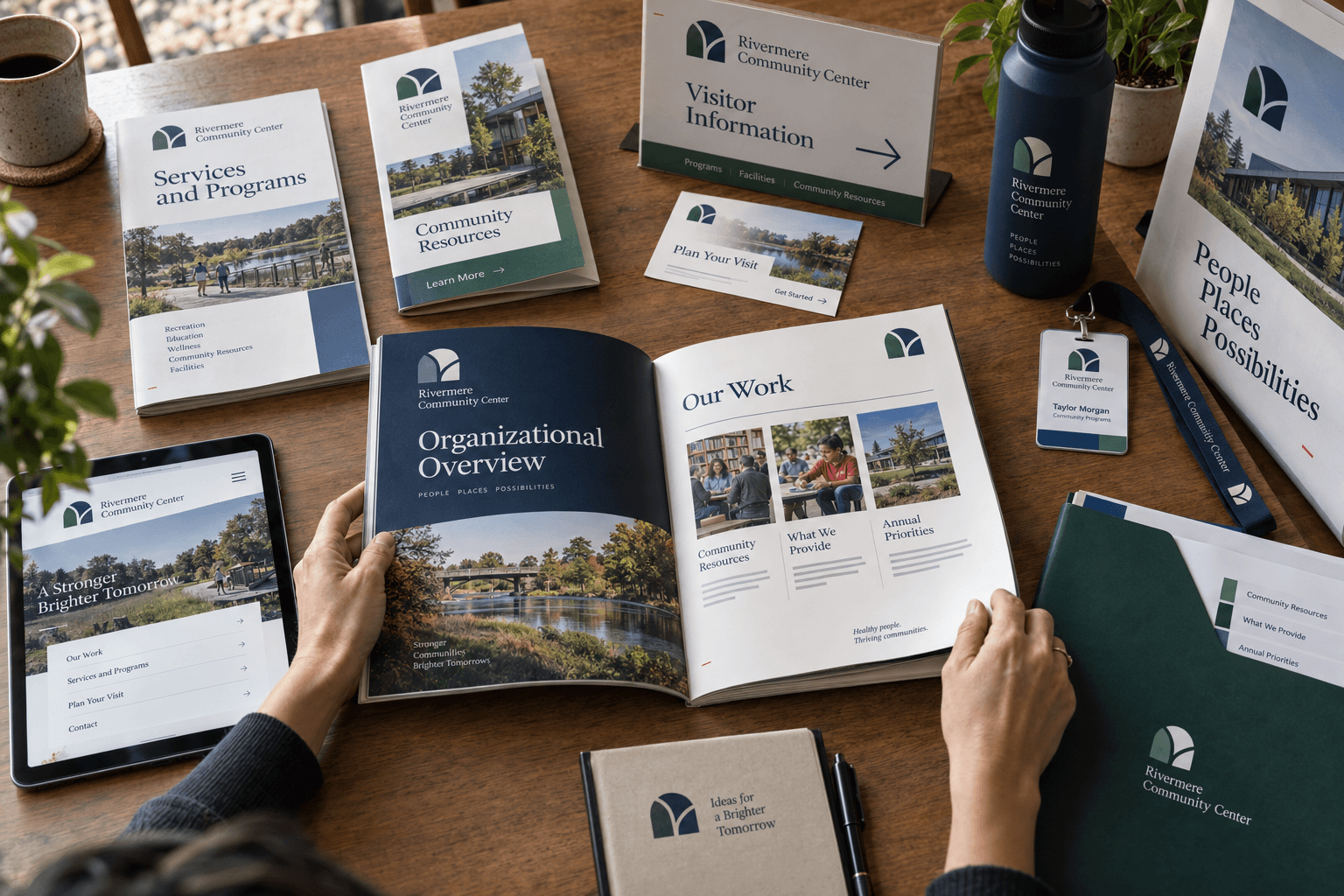A connected organizational identity applied across a booklet, informational materials, signage, event materials, promotional products, and a digital interface.
